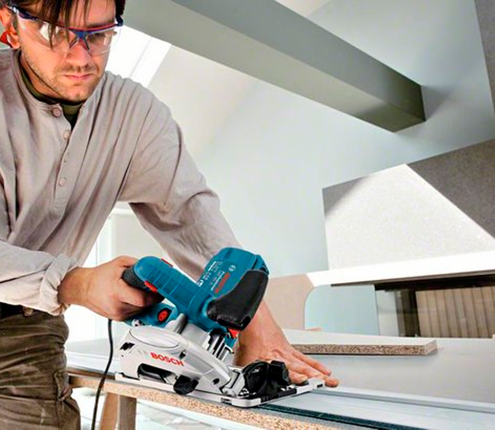 Дисковая пила BOSCH GKS 55+G 1200вт 165мм photo 1